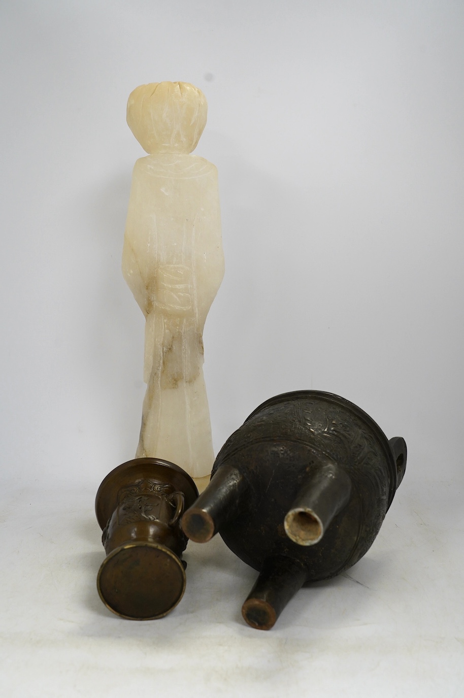 A Chinese alabaster carved model of an elder, a Chinese bronze tripod censer and a Japanese bronze vase, tallest 45cm. Condition - fair
